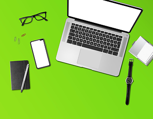 Image showing Office desk mockup top view isolated on green