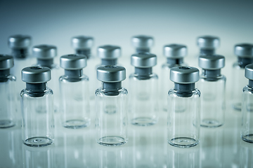 Image showing Vaccine glass bottles on grey background