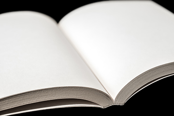 Image showing Open blank book on black background
