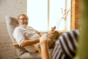 Image showing Senior man working with tablet at home - concept of home studying