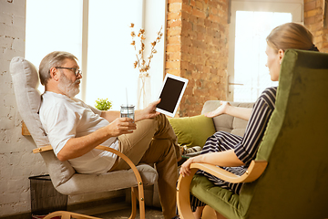 Image showing Senior man working with tablet at home - concept of home studying