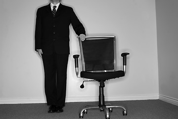 Image showing Businessman and empty chair