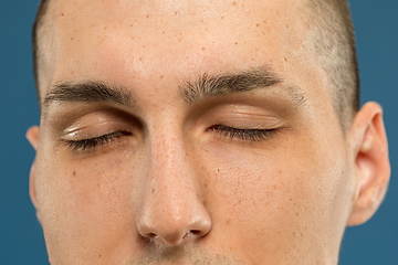 Image showing Caucasian young man\'s close up shot on blue background