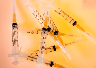 Image showing Syringes on orange background