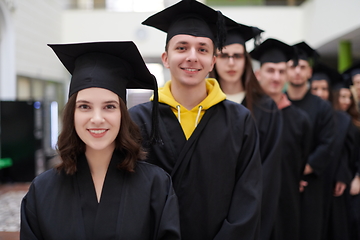 Image showing Group of diverse international graduating students celebrating