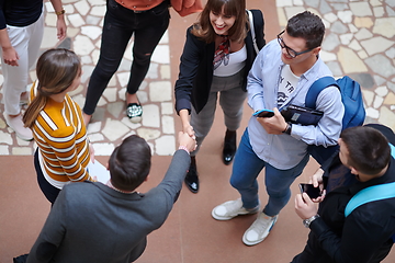 Image showing students communication with professor in school corridor