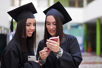 Image showing Group of diverse international graduating students celebrating