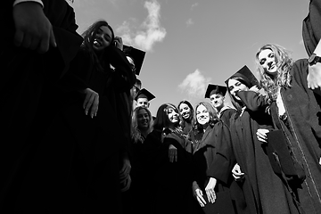 Image showing Group of diverse international graduating students celebrating