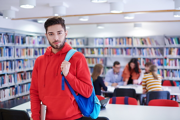 Image showing the student uses a laptop and a school library