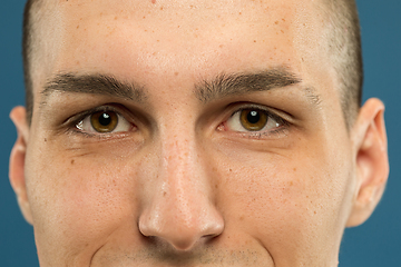 Image showing Caucasian young man\'s close up shot on blue background