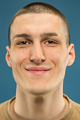 Image showing Caucasian young man\'s close up shot on blue background