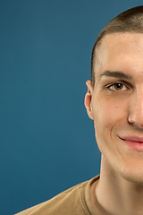 Image showing Caucasian young man\'s close up shot on blue background