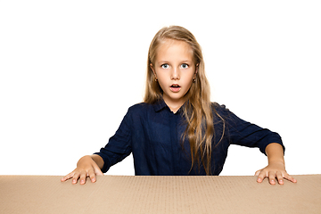 Image showing Cute little girl opening the biggest postal package