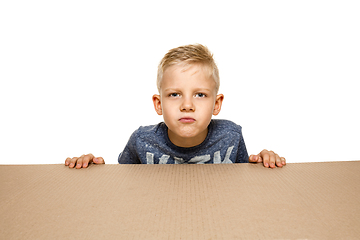 Image showing Cute little boy opening the biggest postal package