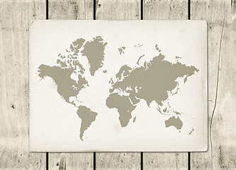 Image showing Vintage world map parchment on a wooden wall