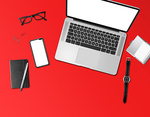 Image showing Office desk mockup top view isolated on red