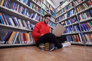 Image showing the students uses a notebook, laptop and a school library