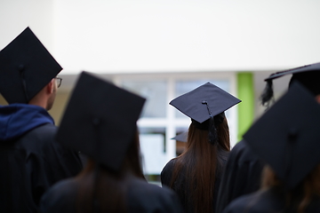 Image showing Group of diverse international graduating students celebrating