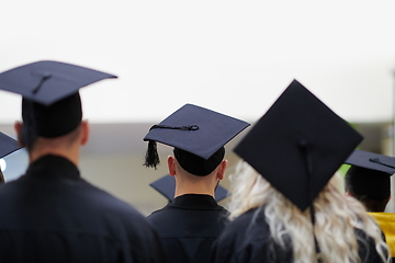 Image showing Group of diverse international graduating students celebrating