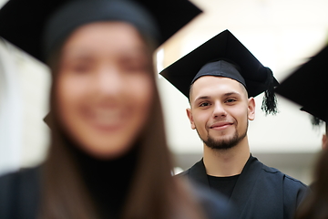 Image showing Group of diverse international graduating students celebrating