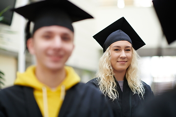 Image showing Group of diverse international graduating students celebrating