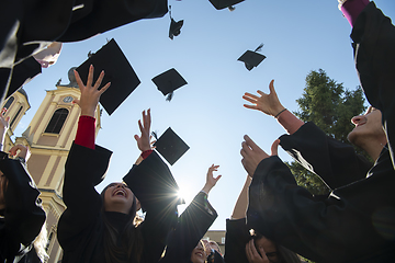 Image showing Group of diverse international graduating students celebrating