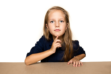 Image showing Cute little girl opening the biggest postal package