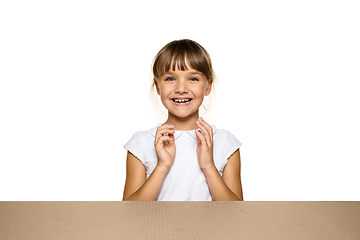 Image showing Cute little girl opening the biggest postal package