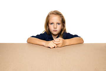 Image showing Cute little girl opening the biggest postal package