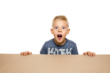 Image showing Cute little boy opening the biggest postal package