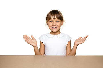 Image showing Cute little girl opening the biggest postal package