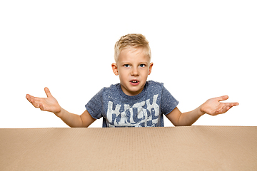 Image showing Cute little boy opening the biggest postal package