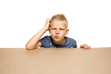 Image showing Cute little boy opening the biggest postal package