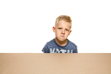 Image showing Cute little boy opening the biggest postal package