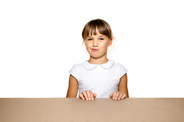 Image showing Cute little girl opening the biggest postal package