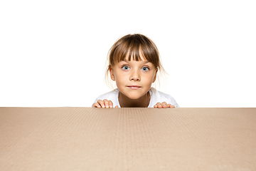 Image showing Cute little girl opening the biggest postal package