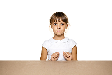 Image showing Cute little girl opening the biggest postal package