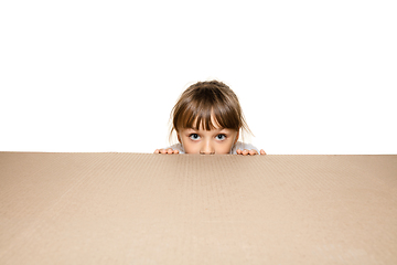 Image showing Cute little girl opening the biggest postal package