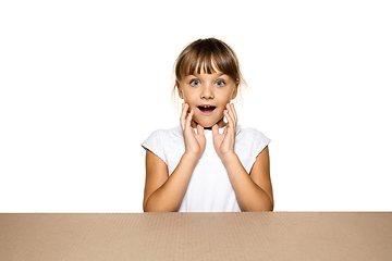 Image showing Cute little girl opening the biggest postal package