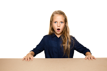 Image showing Cute little girl opening the biggest postal package