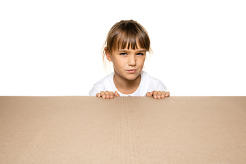 Image showing Cute little girl opening the biggest postal package