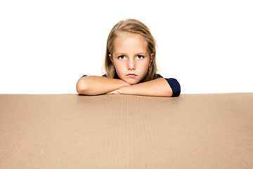 Image showing Cute little girl opening the biggest postal package