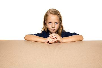 Image showing Cute little girl opening the biggest postal package