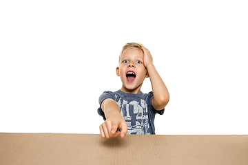 Image showing Cute little boy opening the biggest postal package