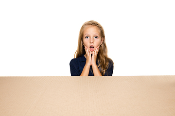 Image showing Cute little girl opening the biggest postal package