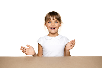 Image showing Cute little girl opening the biggest postal package