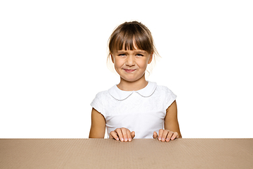 Image showing Cute little girl opening the biggest postal package