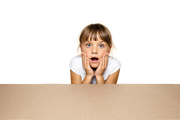 Image showing Cute little girl opening the biggest postal package