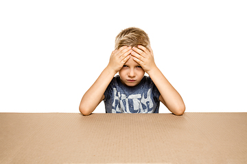 Image showing Cute little boy opening the biggest postal package