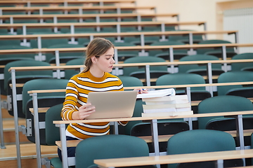 Image showing student taking notes for school class